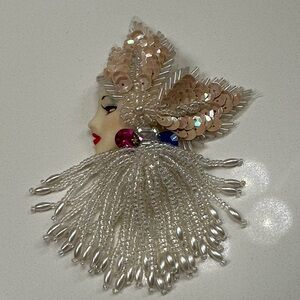 Elegant Beaded Face Brooch with Silver and Pink Accents